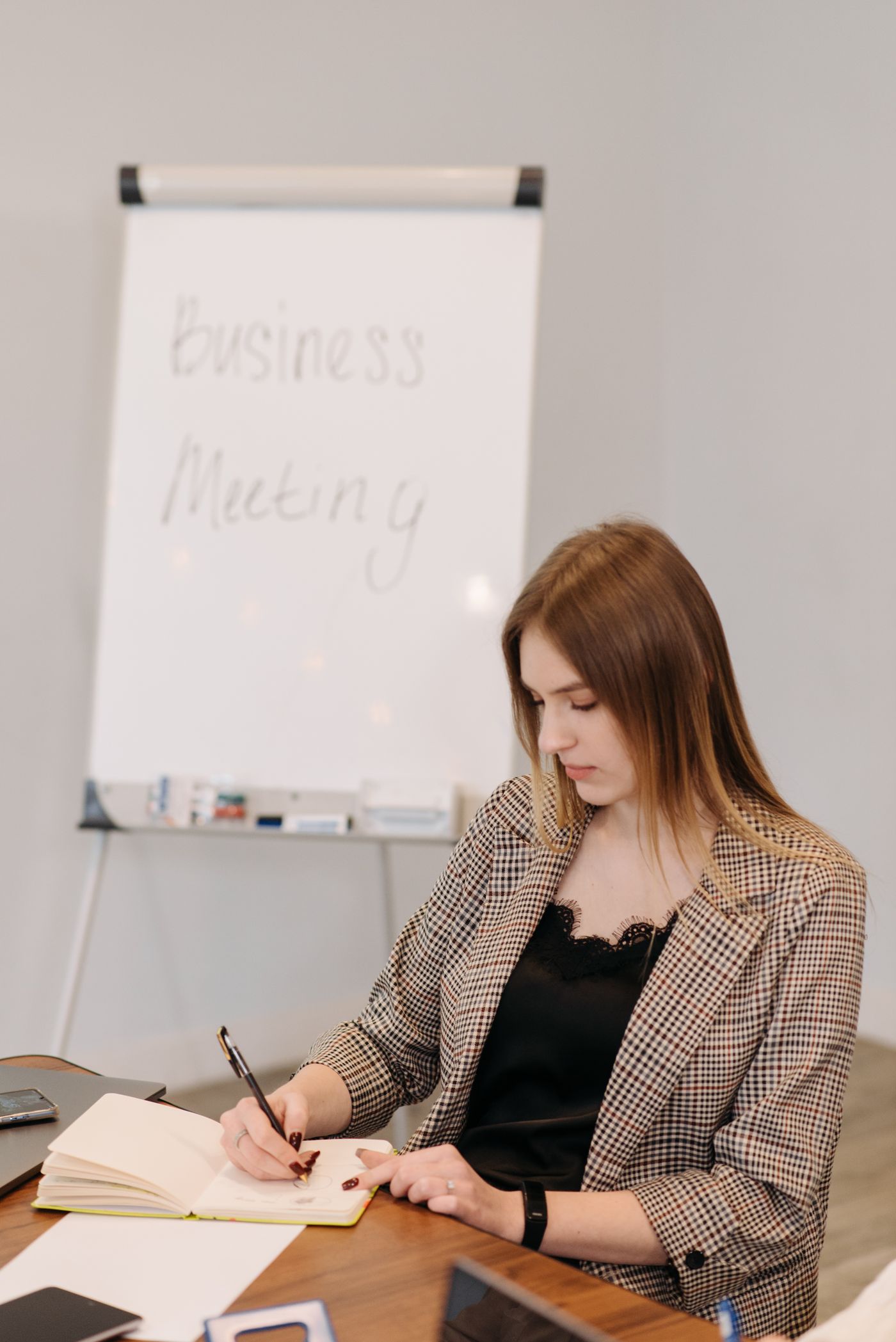 A woman writing in a notebook